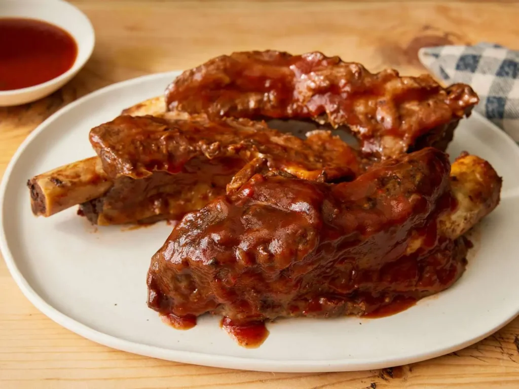 Fork tender slow cooker beef ribs with caramelized BBQ glaze