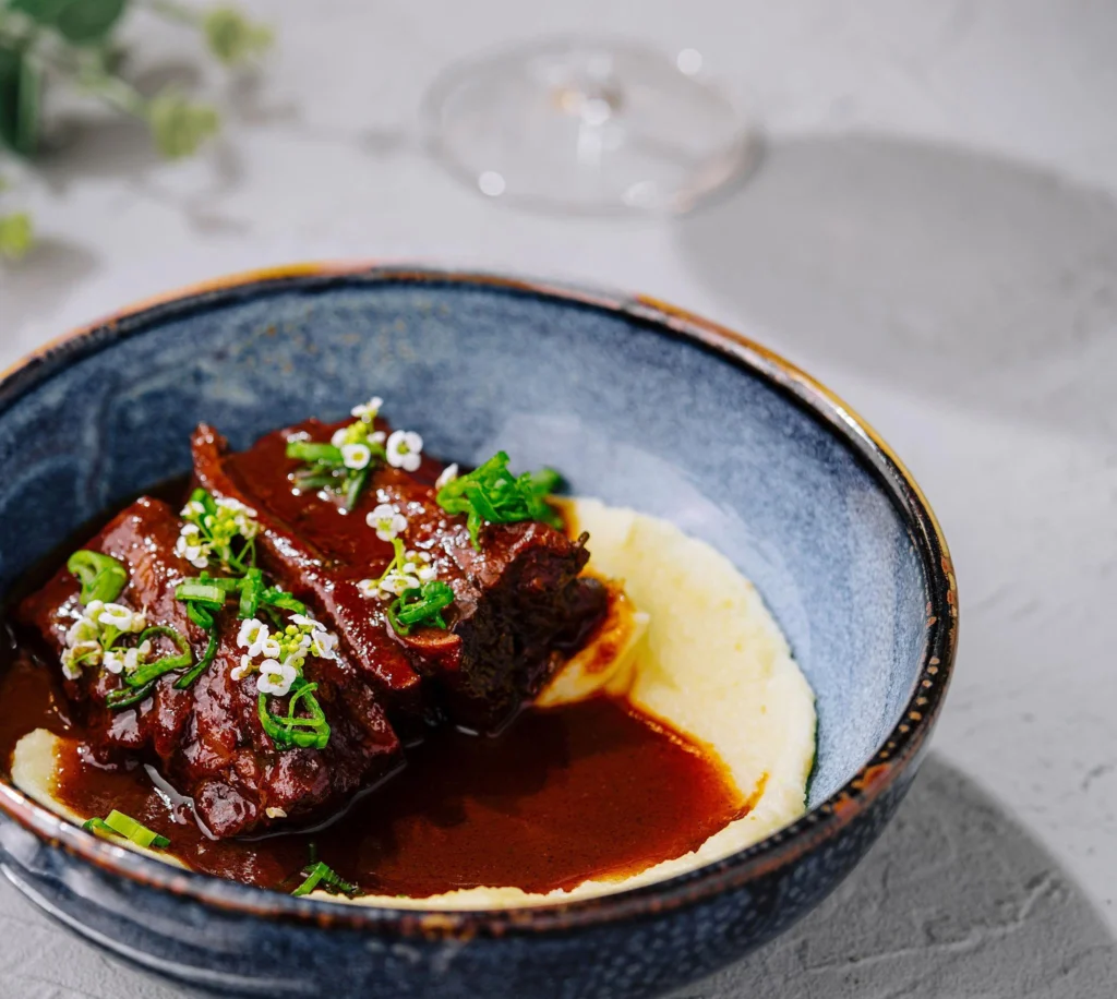 Beef short ribs served with mashed potatoes and rich gravy