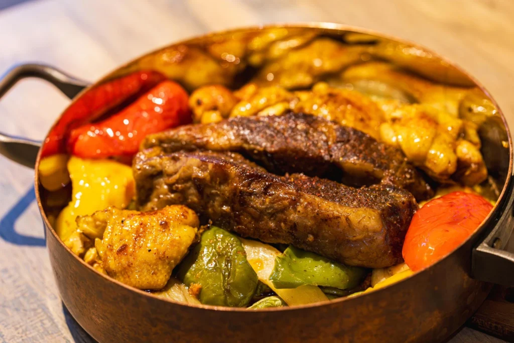 One pot short ribs cooking slowly in a Dutch oven
