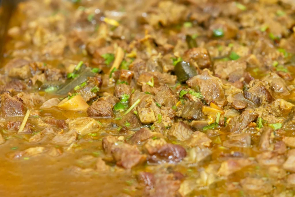 slow cooker beef stew with tender beef potatoes and carrots in rich gravy
