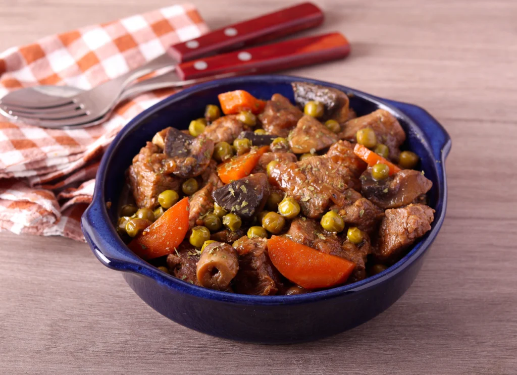 slow cooker beef stew with mushrooms carrots and tender beef in rich gravy